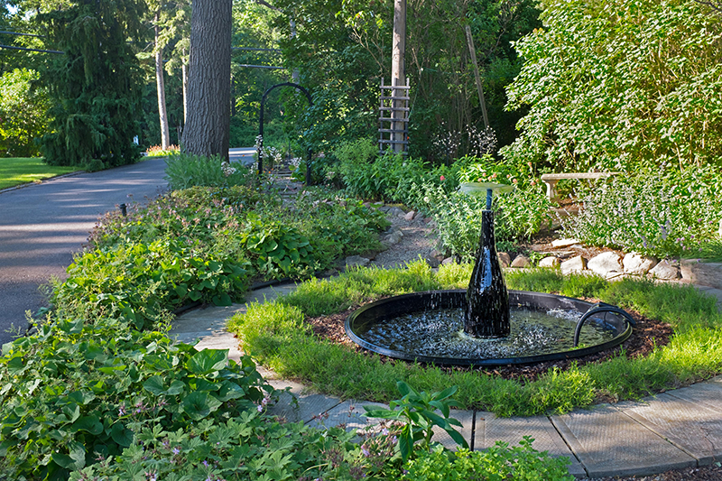 Garden Tour stop features backyard with a golf green