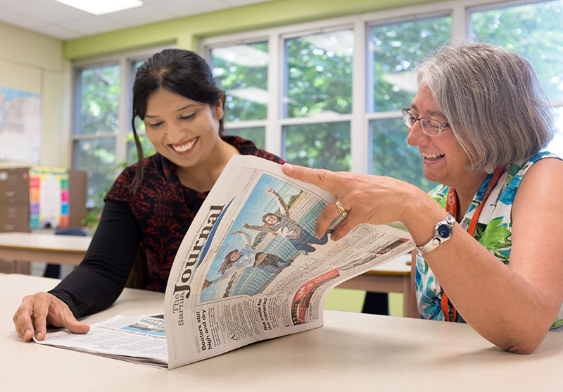 Newcomers using newspaper to learn about the city