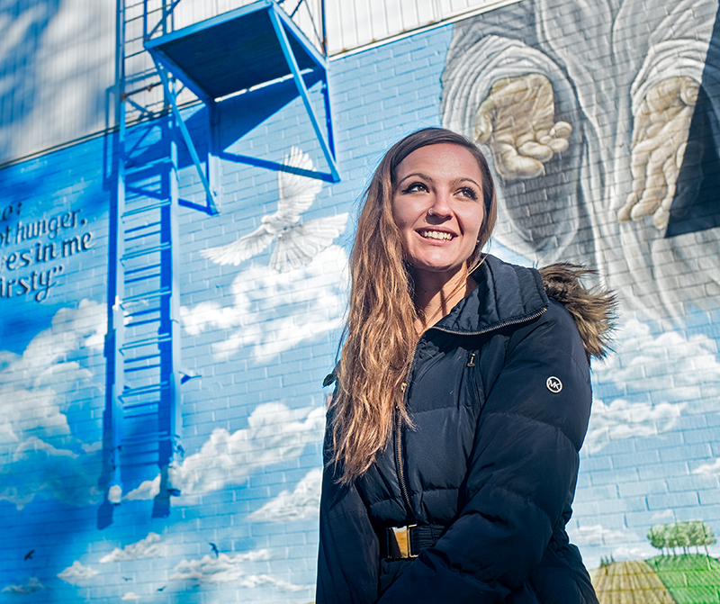New mural brightens up drab wall at the St. Vincent de Paul