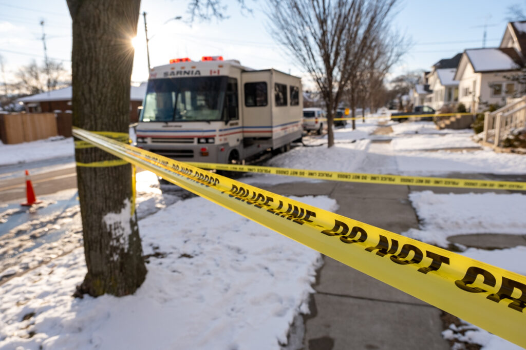 Updated: One suspect in custody, another identified in Devine Street homicide
