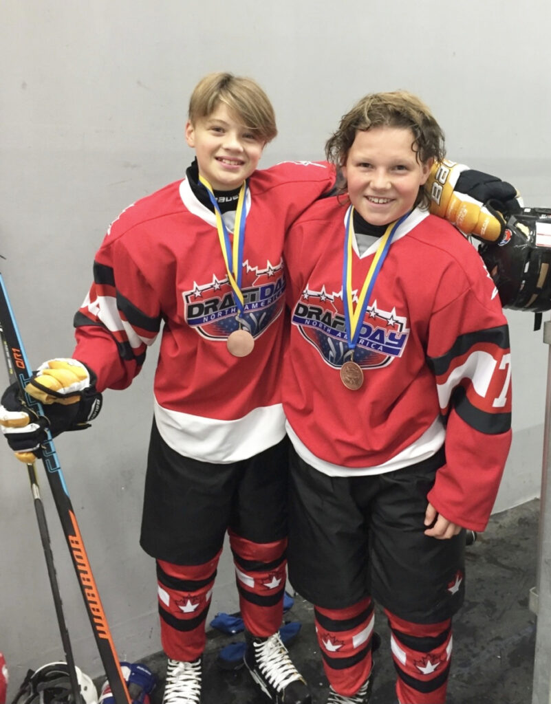 Buddies off the ice, teens climb hockey ranks together