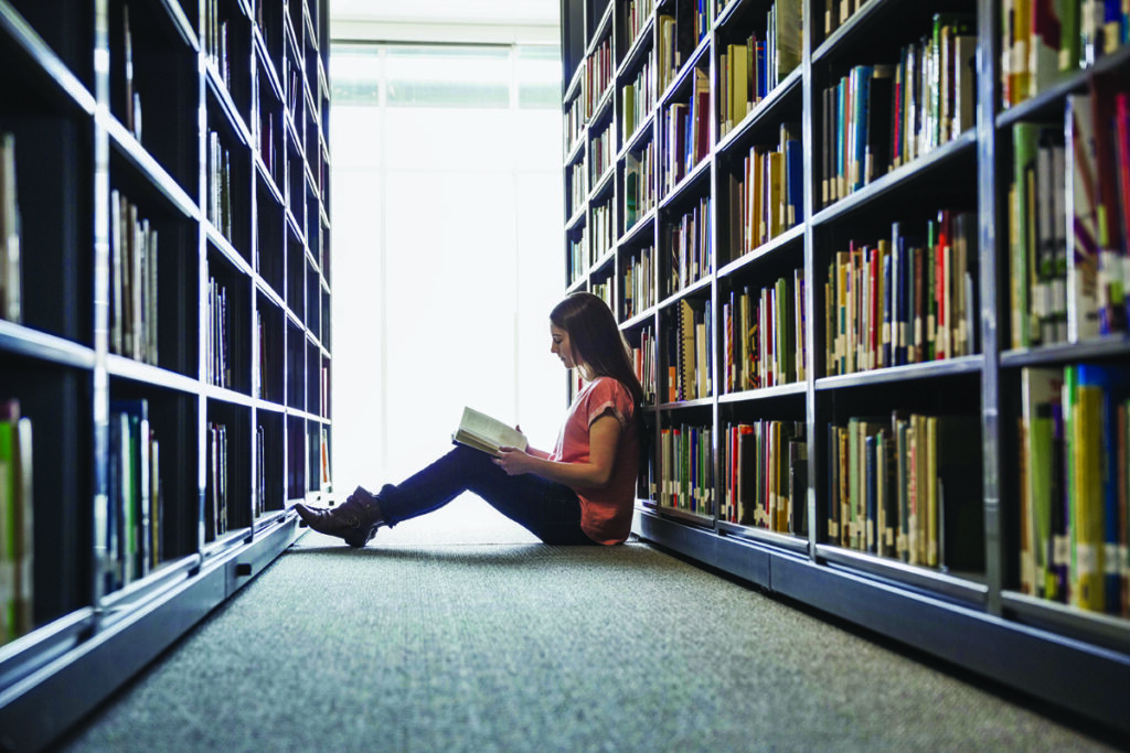 Library shelves overdue fines on books, materials
