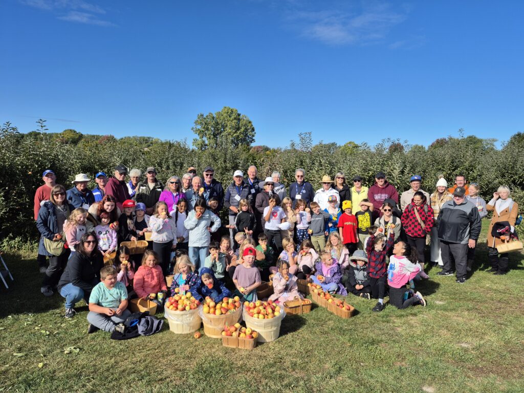 Queen Elizabeth students pick apples for local food banks