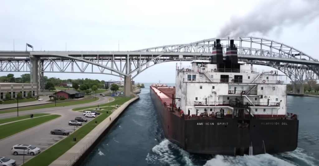 Bulk carrier American Spirit veers close to shore beneath Blue Water Bridge