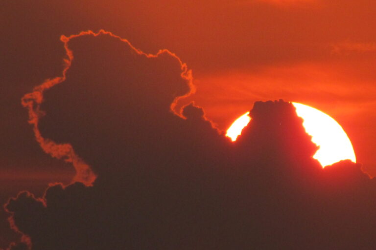 Sun behind clouds