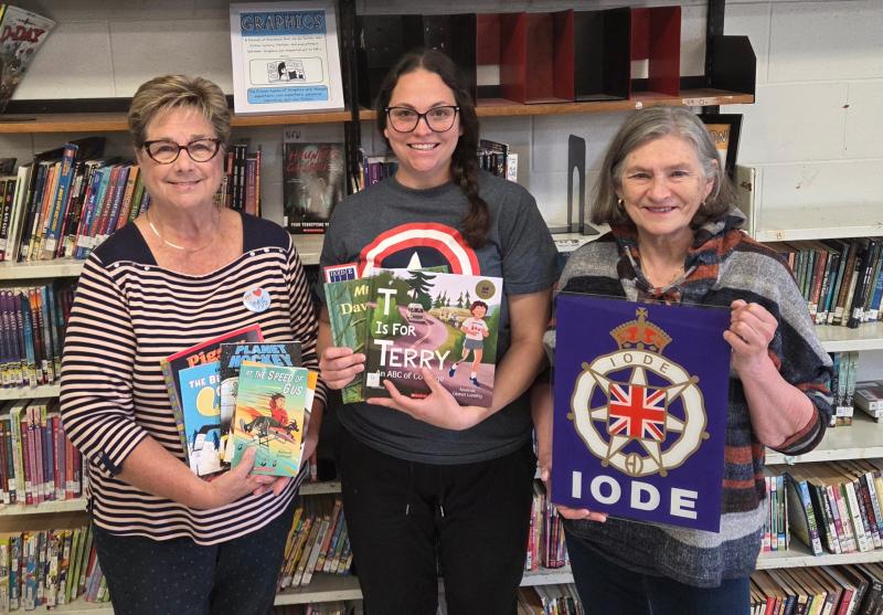 Honourable Malcolm Cameron Chapter brings books and supplies to London Road School
